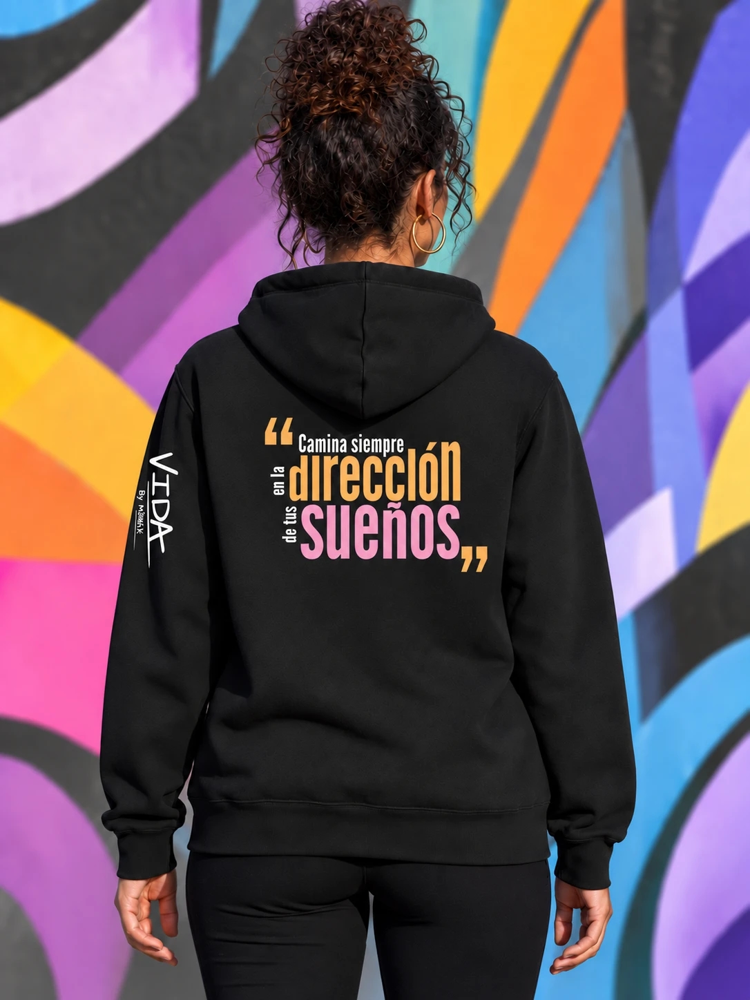 Alegría, back of the black hoodie with optional Spanish message: Camina siempre en la dirección de tus sueños
